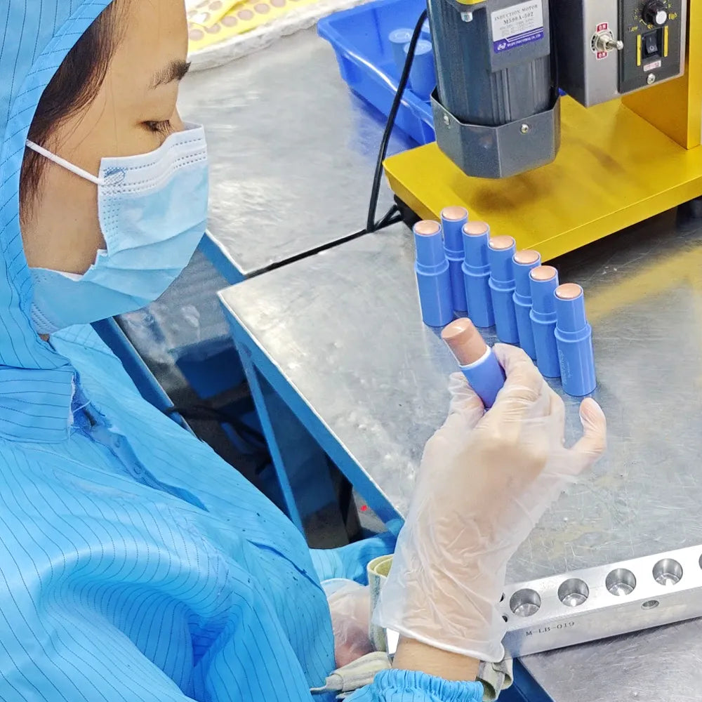 Professional makeup manufacturer staff performing quality inspection at our early cosmetic oem manufacturer workshop to ensure stable quality systems.