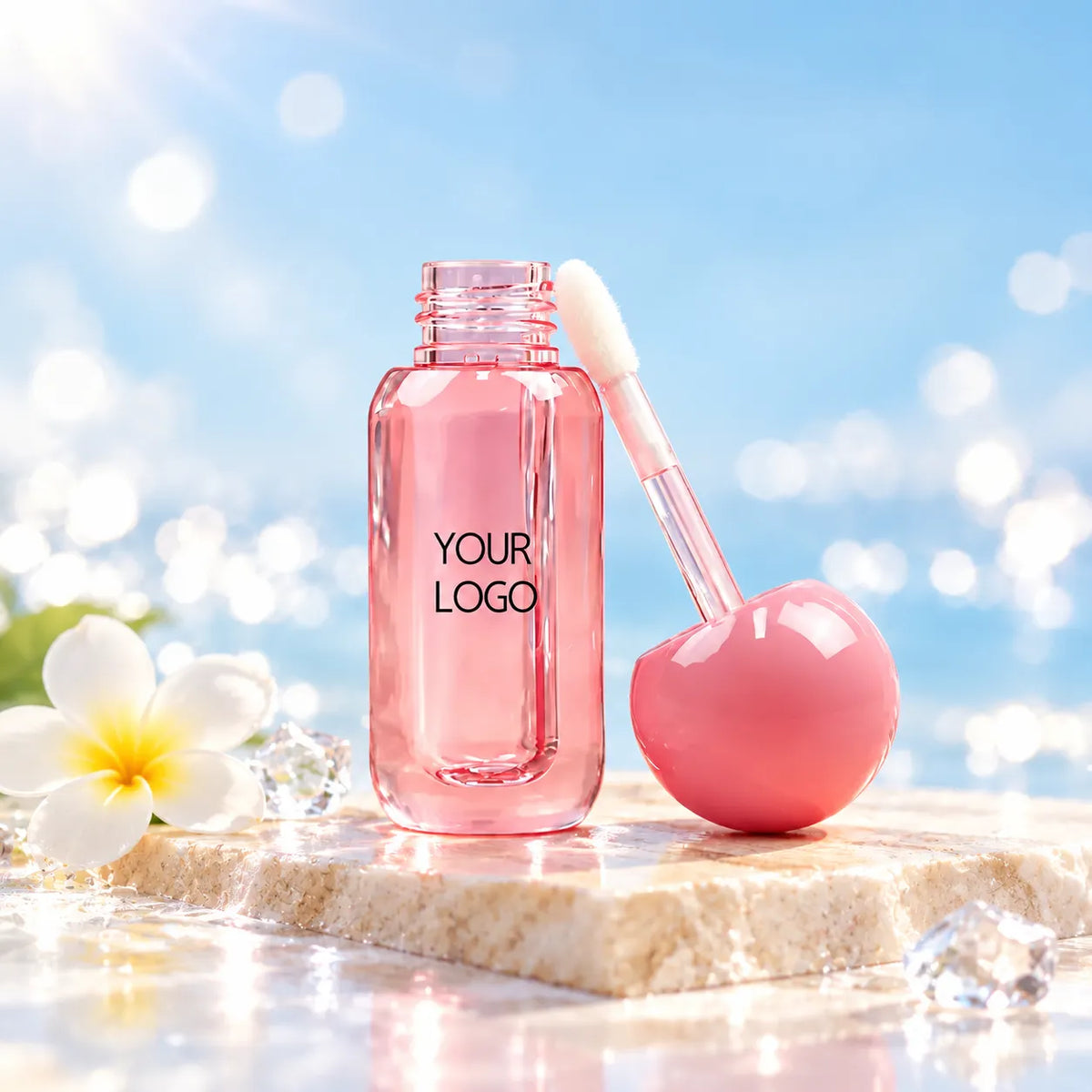 KAIYA C27094 mini lip gloss container with a pink ball-shaped cap and wand applicator on a seaside display