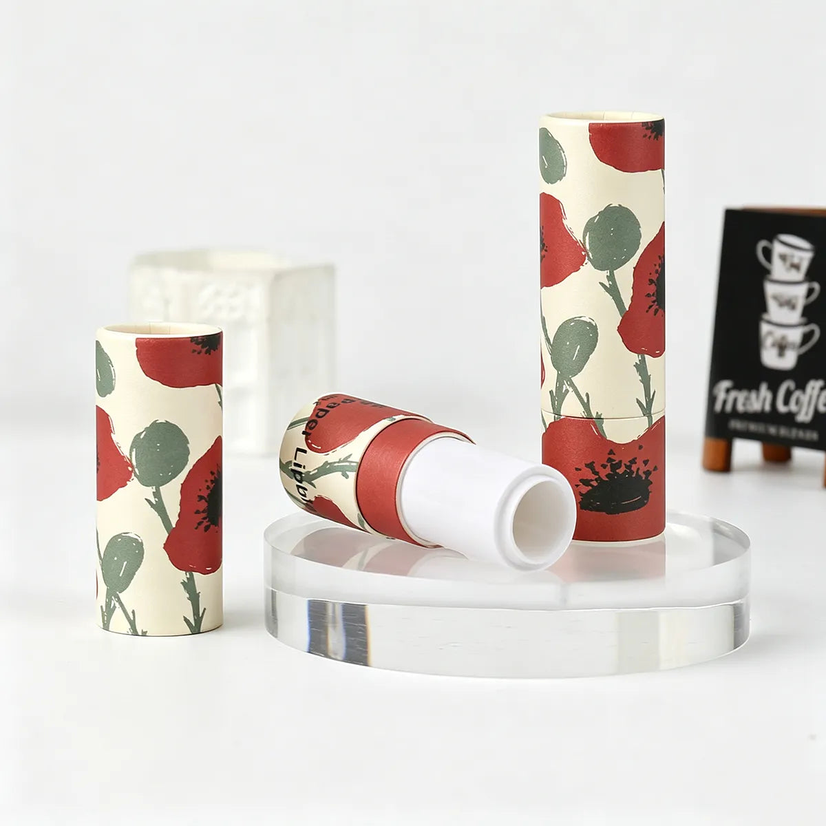 Kaiya paperboard lip balm containers with custom printed artwork for lip balm packaging projects.