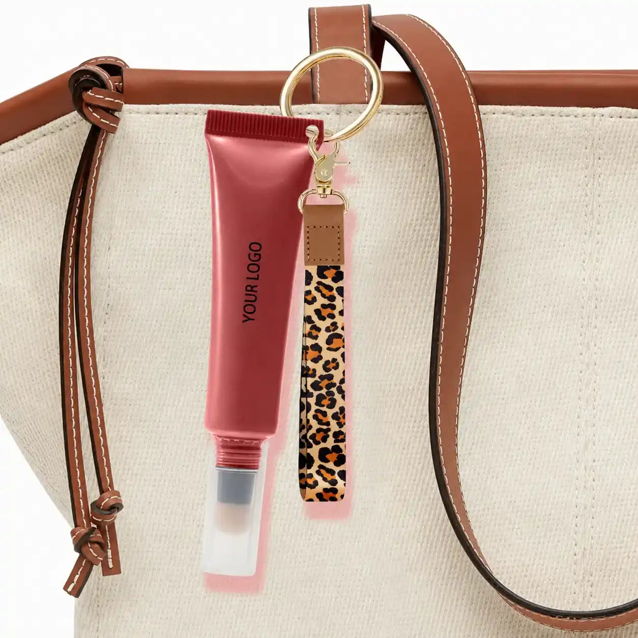 Pink lip gloss squeeze tube containers with keychain for portable lip gloss packaging, ideal for beauty brands, travel cosmetics, and custom cosmetic packaging.