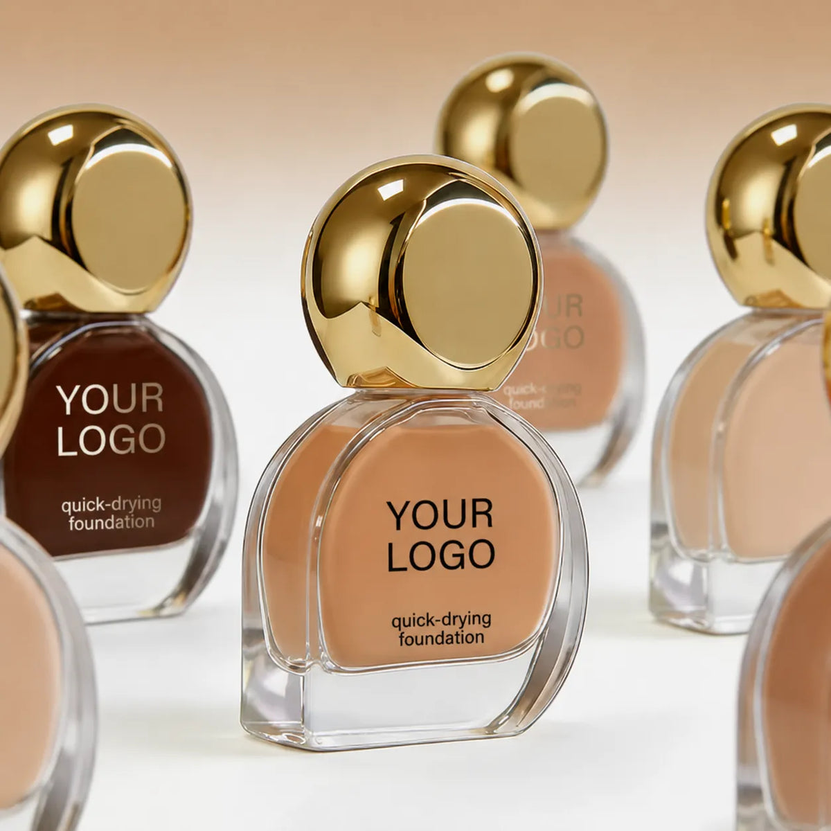 Private label makeup foundation products with custom branding, gold cap design, and multiple shade options for beauty brands