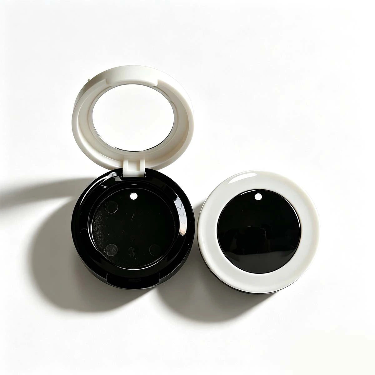 Round **eyeshadow containers** in black and white compact case design, suitable for single-pan eyeshadow and custom eye makeup packaging projects.
