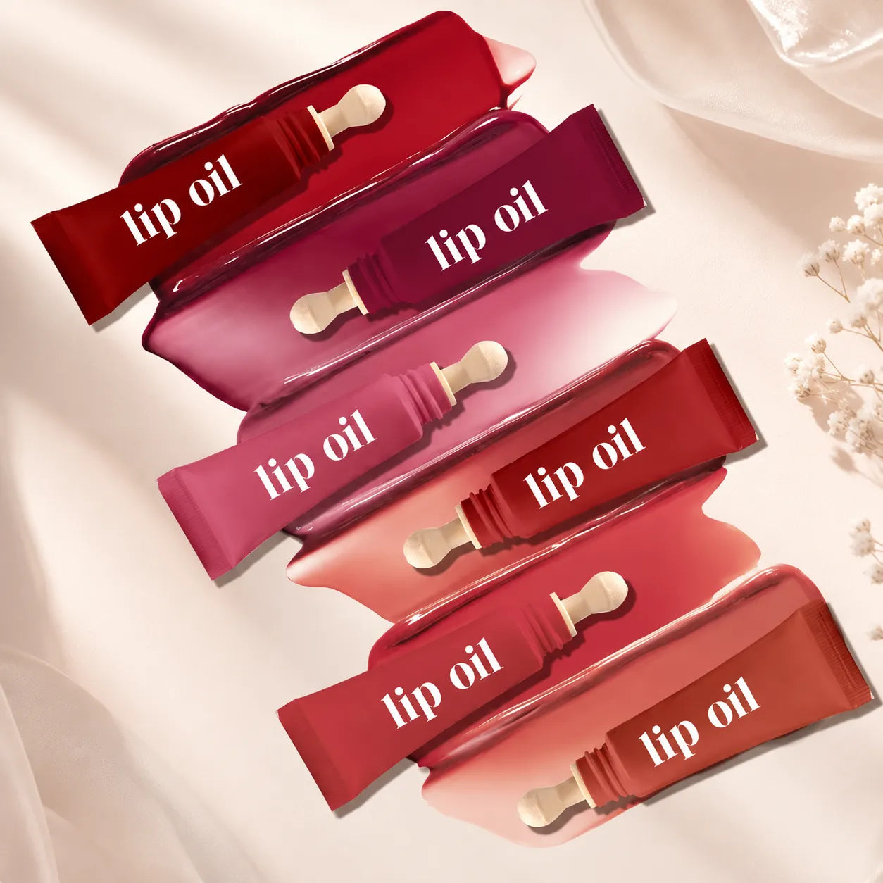 Kaiya squeeze tube lip oil packaging with multiple soft tube colors and applicator tips for custom lip oil product lines.