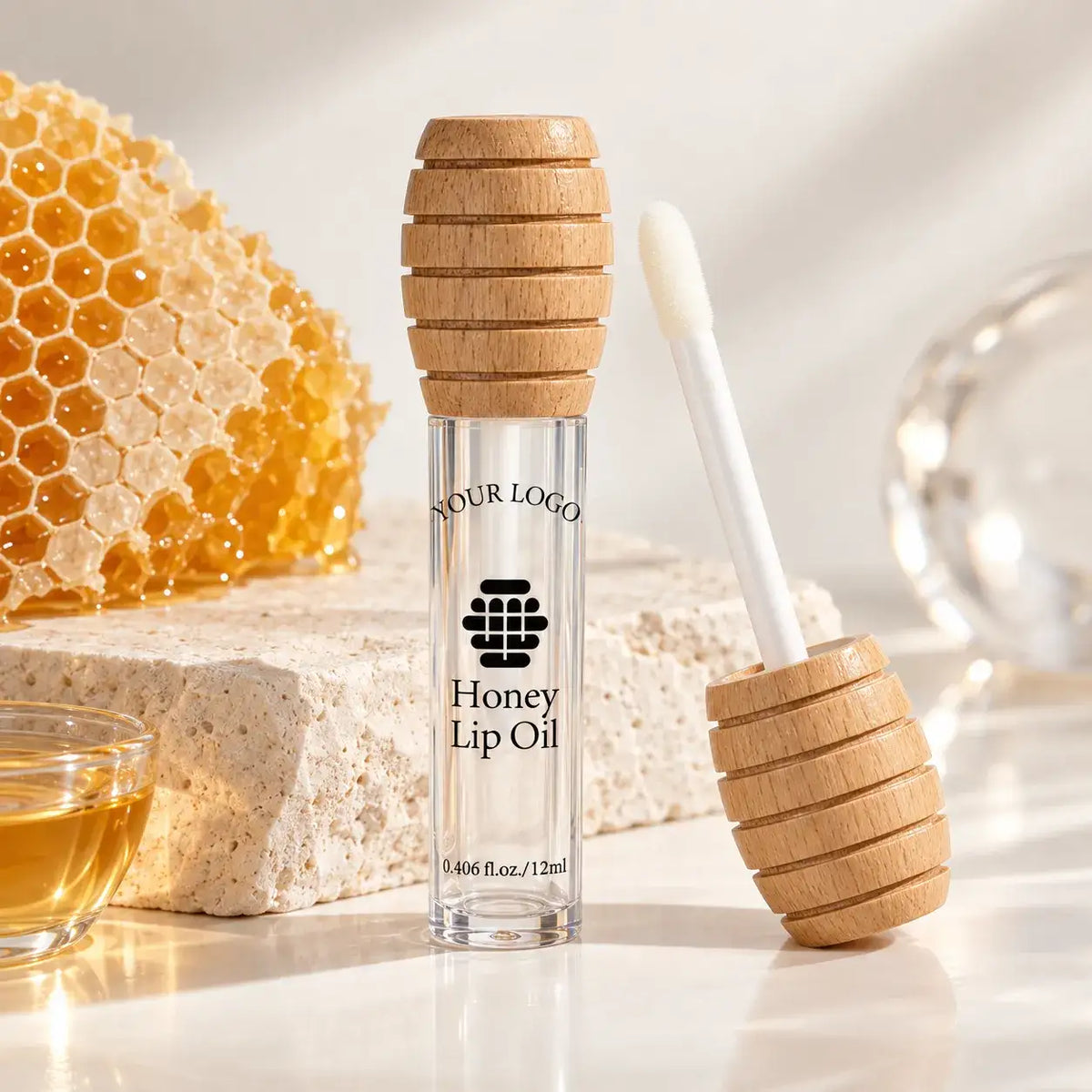 Unique lip gloss packaging with honey-inspired molded cap and clear cosmetic container, Kaiya