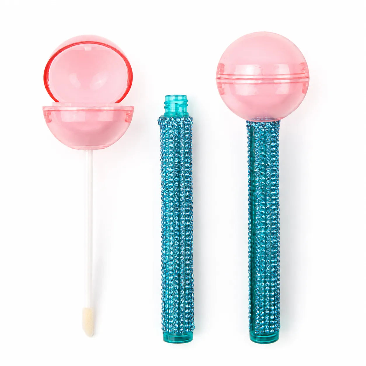 Kaiya kids makeup packaging with cute lip gloss tubes featuring pink lollipop-shaped caps and blue textured handles.