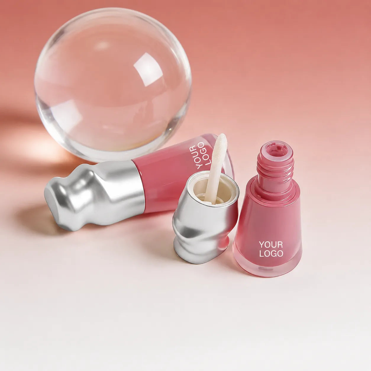 Pink liquid lipstick containers with wand applicator and custom logo packaging display.