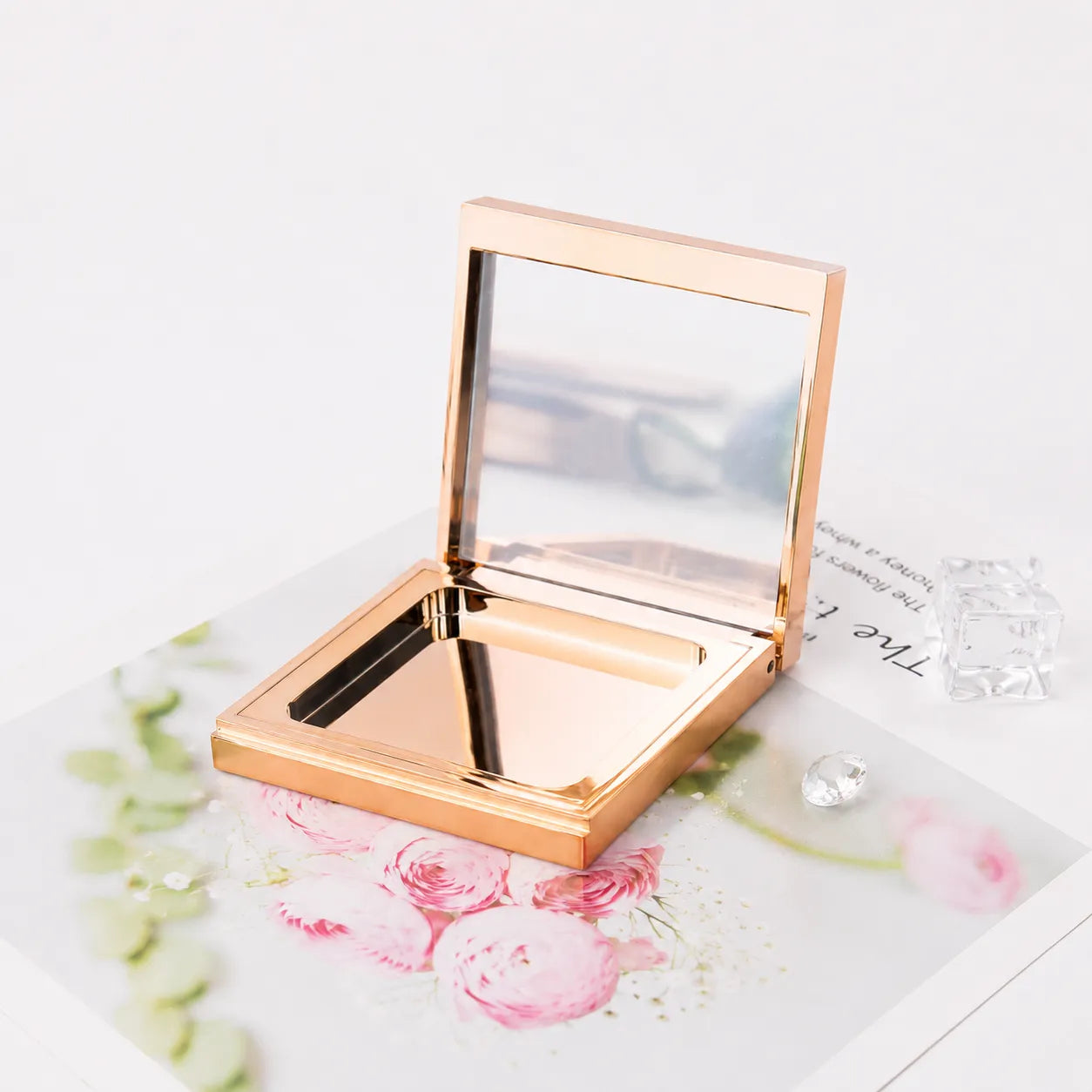 Magnetic makeup palette with mirror in a gold finish for Kaiya pressed powder and eyeshadow palette packaging.